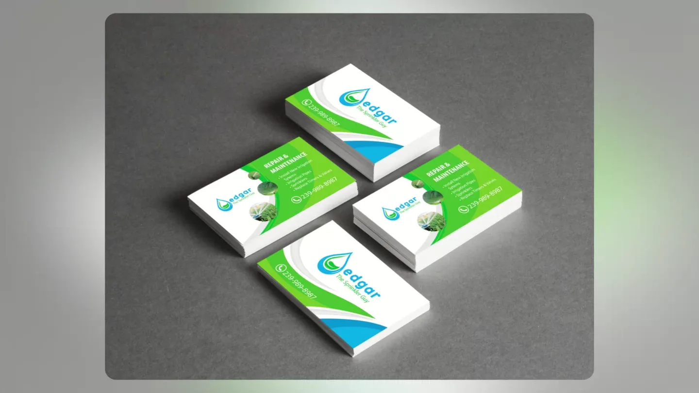 Green, blue, and white business cards for Edgar The Sprinkler Guy